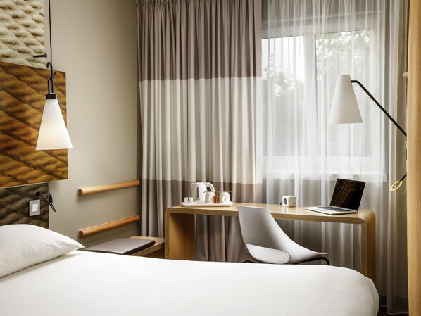 Memory foam beds, desk, laptop workspace, blackout drapes