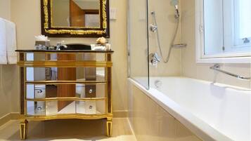 Combined shower/tub, designer toiletries, hair dryer, bathrobes