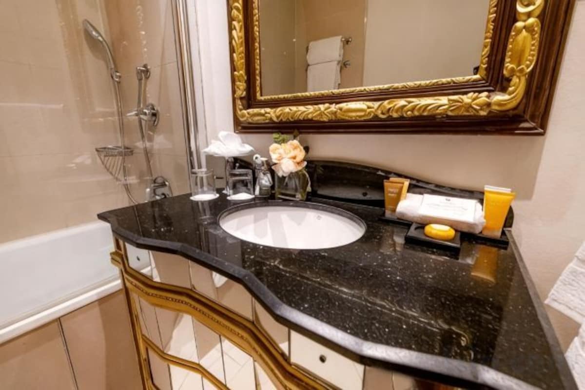 Combined shower/tub, designer toiletries, hair dryer, bathrobes
