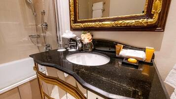 Combined shower/tub, designer toiletries, hair dryer, bathrobes