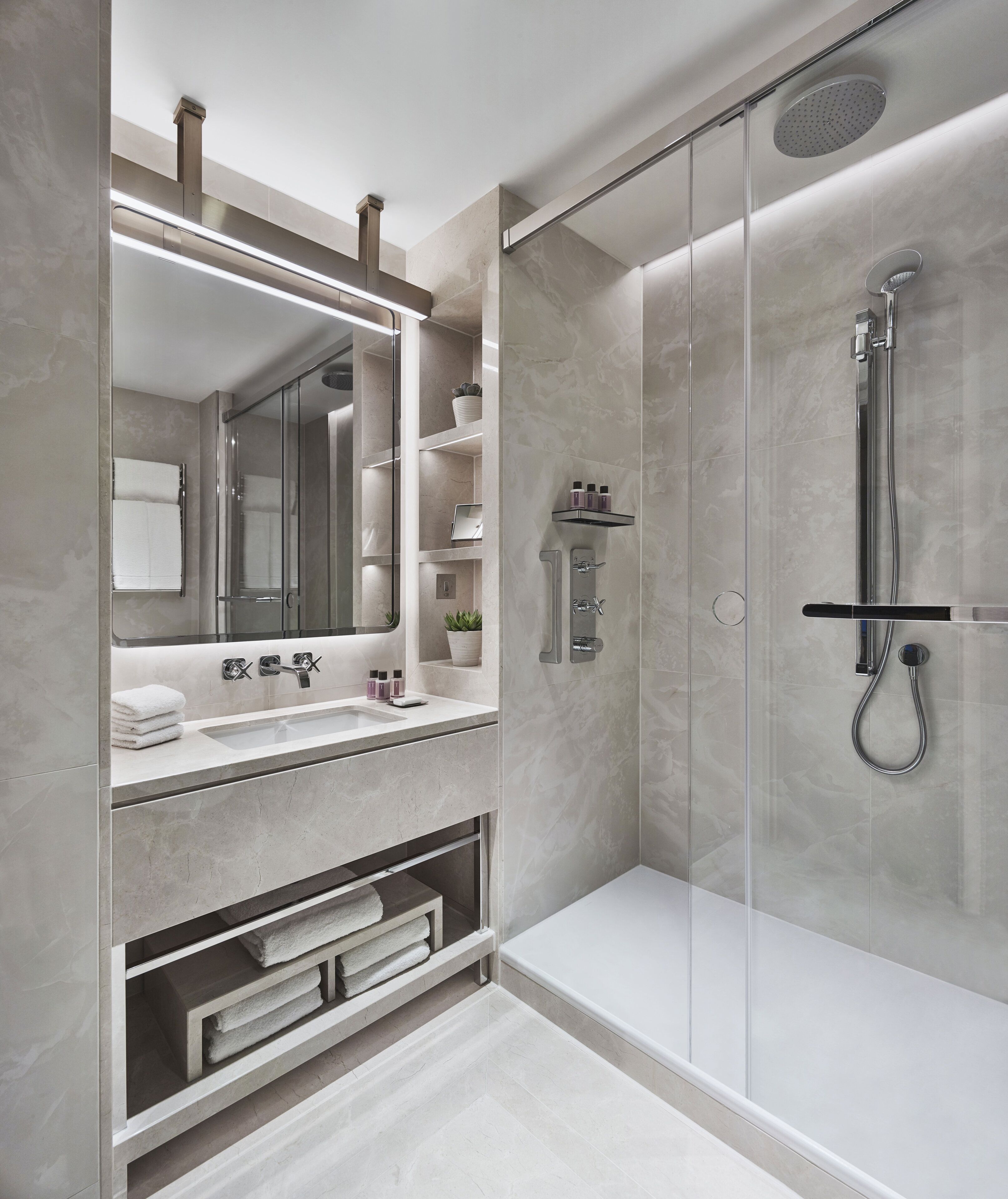 designer toiletries, hair dryer, bathrobes, slippers