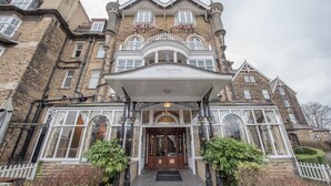 A historic hotel with a prominent entrance, large windows, and a classic architectural style. - Cairn Hotel (Harrogate)