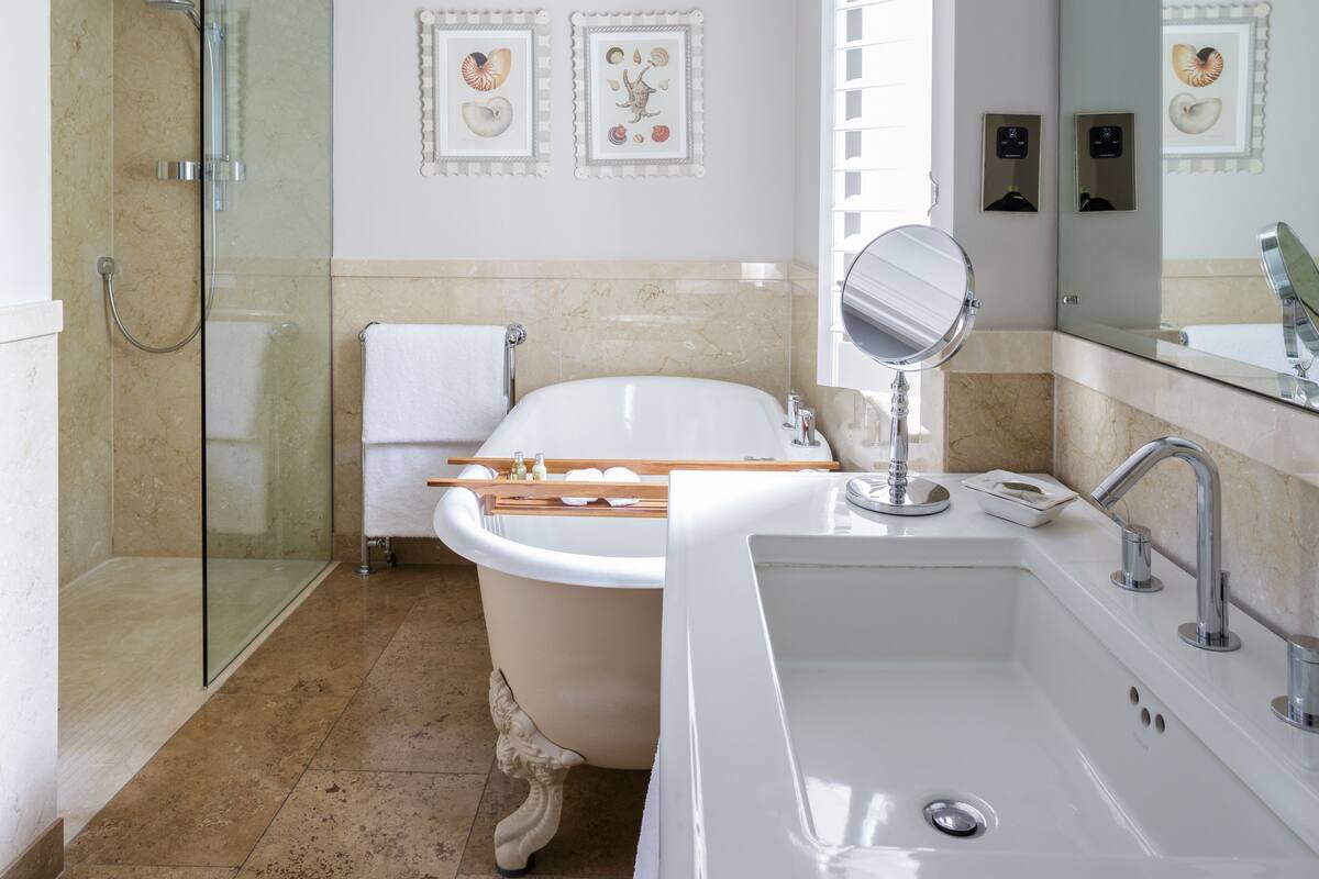 premier deluxe | bathroom | combined shower/bathtub, designer toiletries, hair dryer, bathrobes