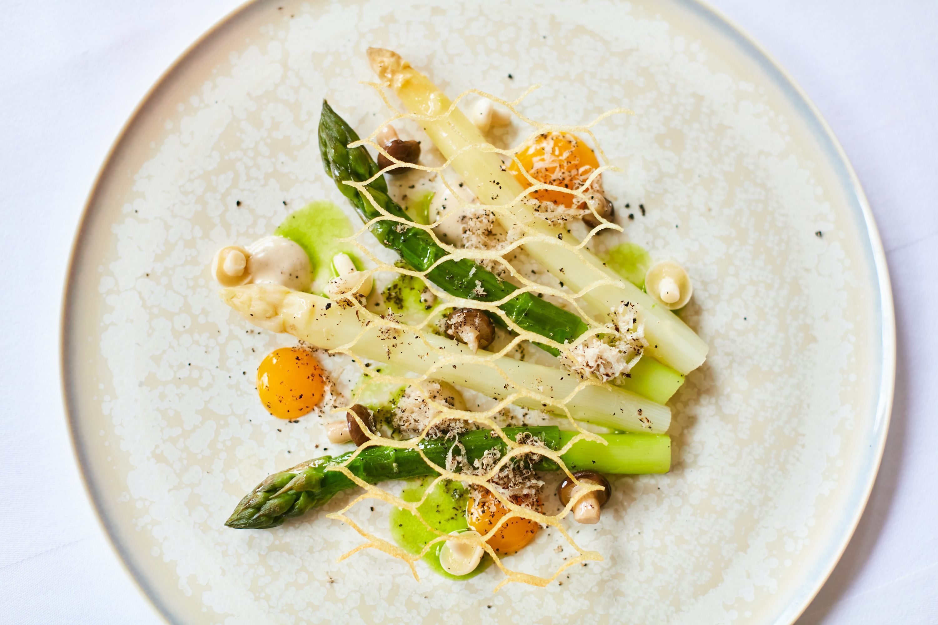A plate of food with various vegetables and garnishes.