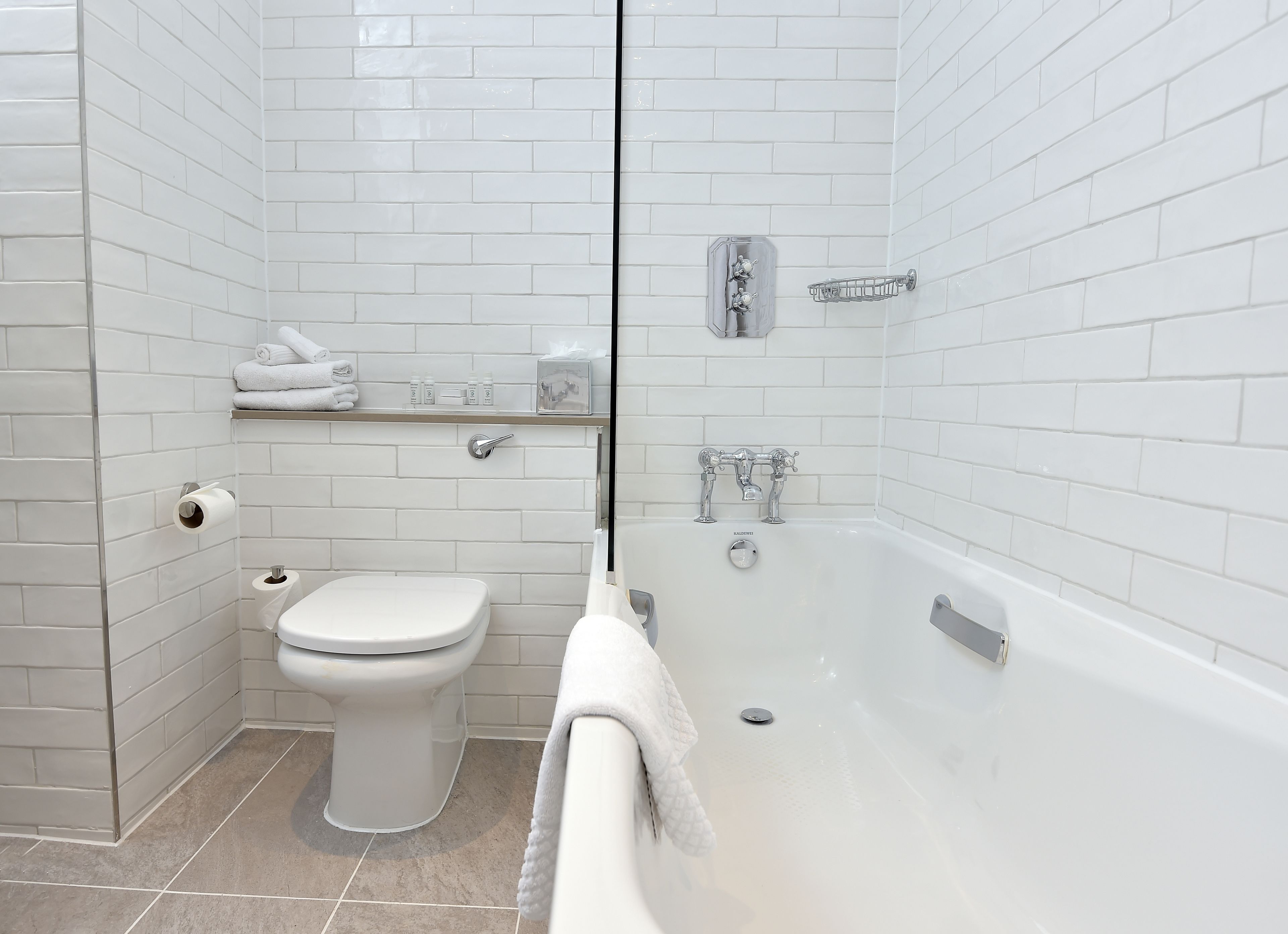 deluxe double room | bathroom | designer toiletries, hair dryer, slippers, towels