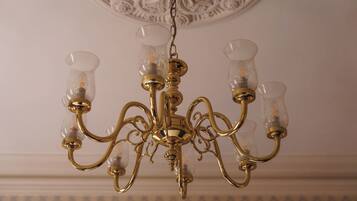 A chandelier with multiple arms and clear glass shades.