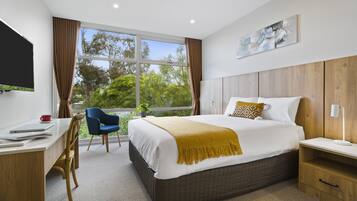 Premium bedding, desk, blackout drapes, iron/ironing board