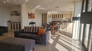 Executive Penthouse | Living area | 32-inch LCD TV with cable channels, TV