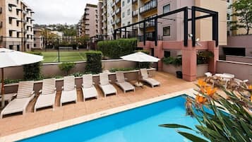 Outdoor pool, open 7:00 AM to 7:00 PM, pool umbrellas, sun loungers