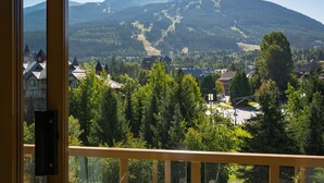 A mountain view from a window with a balcony railing. - Whistler Cascade Lodge (Whistler)