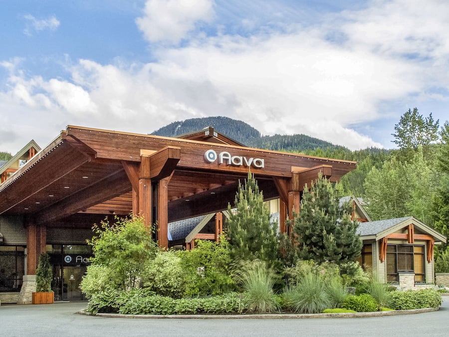 A wooden building with a sign reading "Nava."