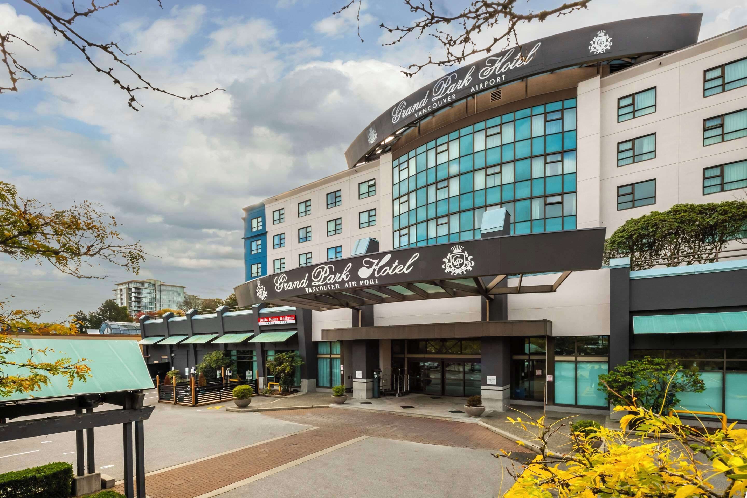 A hotel with a prominent sign reading "Grand Park Hotel Vancouver Airport."