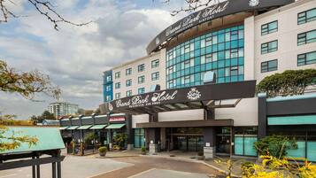 A hotel with a prominent sign reading "Grand Park Hotel Vancouver Airport."