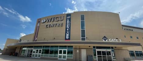 A building with the signage "Windsor Family Credit Union Centre" and "Home of the Spitfires" on its facade.