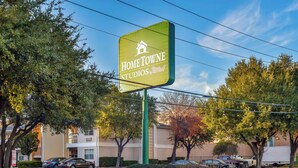 A residential area with a sign for 'Home TOWNE Studios by RedRoof' indicating a possible commercial or studio space. - HomeTowne Studios By Red Roof Dallas - North Addison/ Tollway (Dallas)