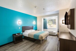 Desk, laptop workspace, blackout curtains, iron/ironing board