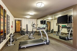 A hotel gym with treadmills, exercise bikes, and weights. - Comfort Inn Tupelo Central (Tupelo)