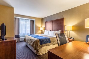 Premium bedding, desk, laptop workspace, blackout drapes