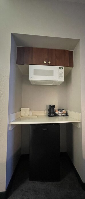 Desk, laptop workspace, blackout drapes, iron/ironing board