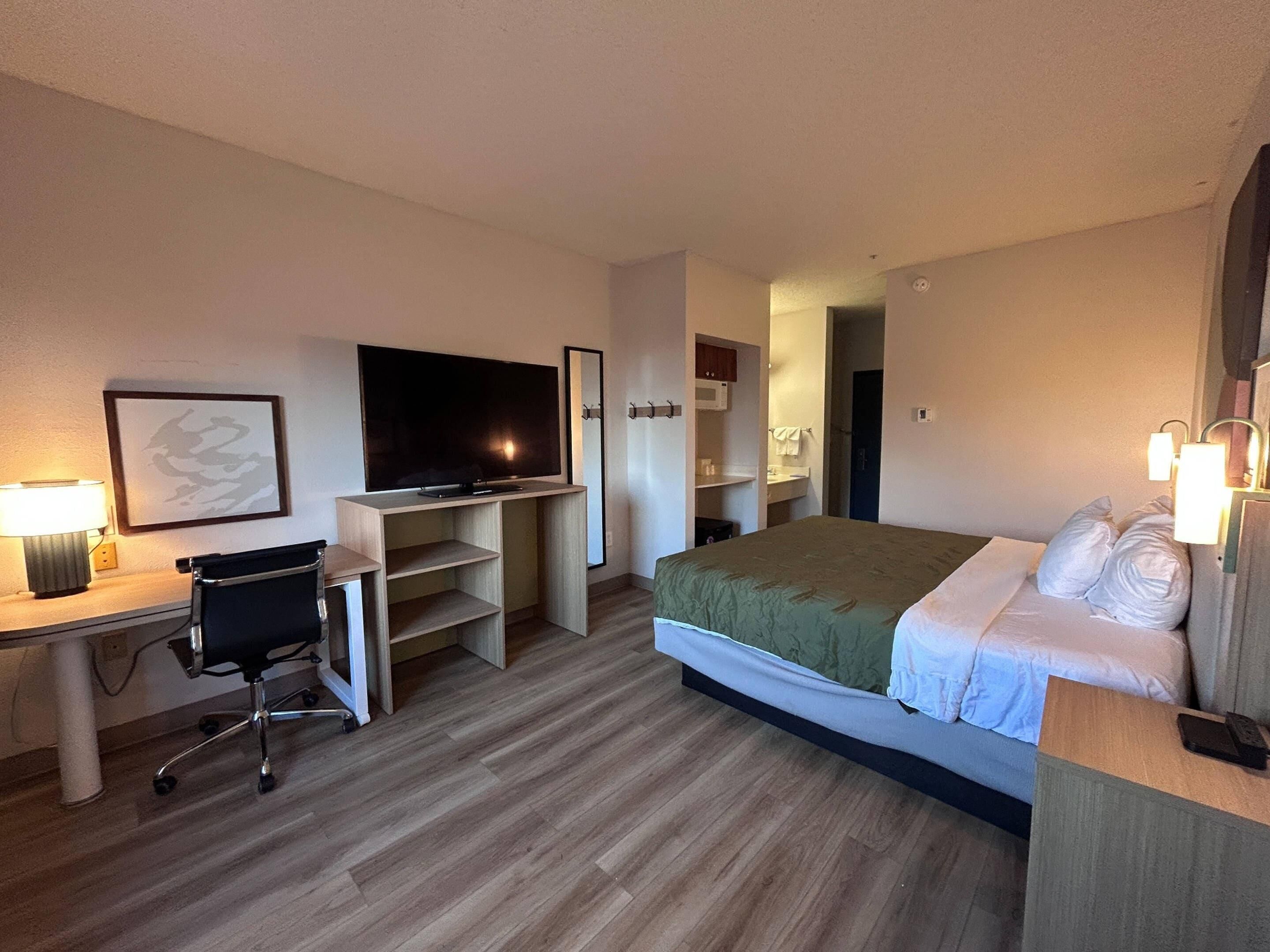 Desk, laptop workspace, blackout curtains, iron/ironing board