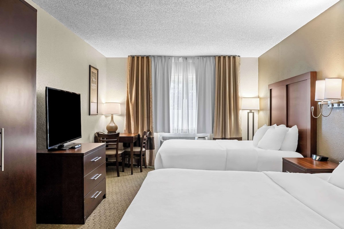 Double Room, 2 Queen Beds, Non Smoking | Blackout drapes, iron/ironing board, free cribs/infant beds, free WiFi