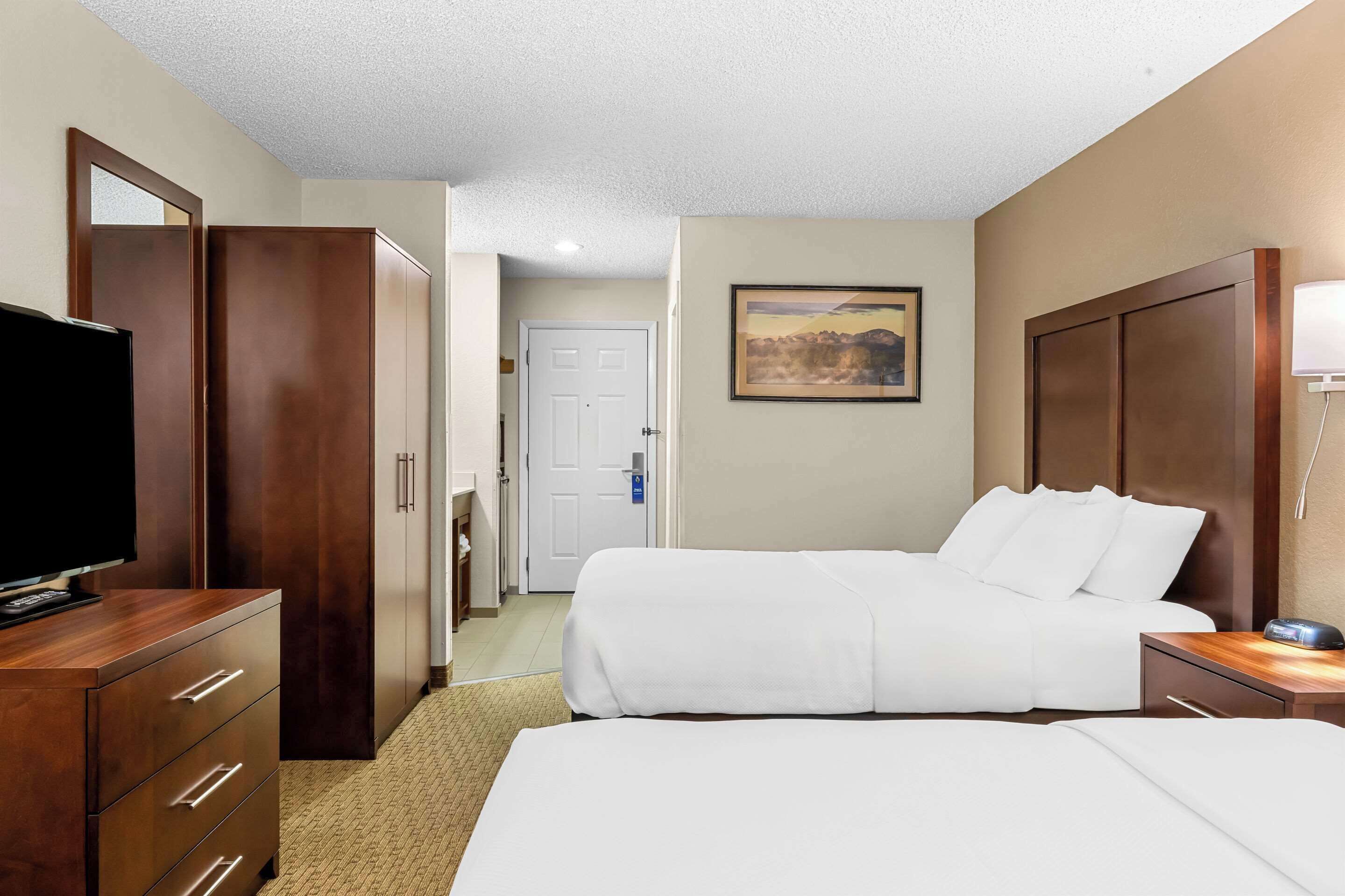 room, 2 queen beds, non smoking, ground floor | blackout curtains, iron/ironing board, free cots/infant beds, free wifi