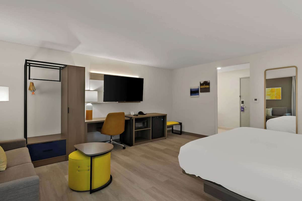 Suite, 1 King Bed with Sofa bed, Non Smoking | Desk, laptop workspace, blackout drapes, iron/ironing board