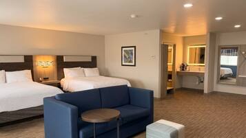 Premium bedding, pillow-top beds, desk, laptop workspace