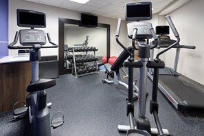 A gym with treadmills, elliptical machines, and a weight rack. - Holiday Inn Express Harrisburg I-81 – Hershey by IHG (Harrisburg)