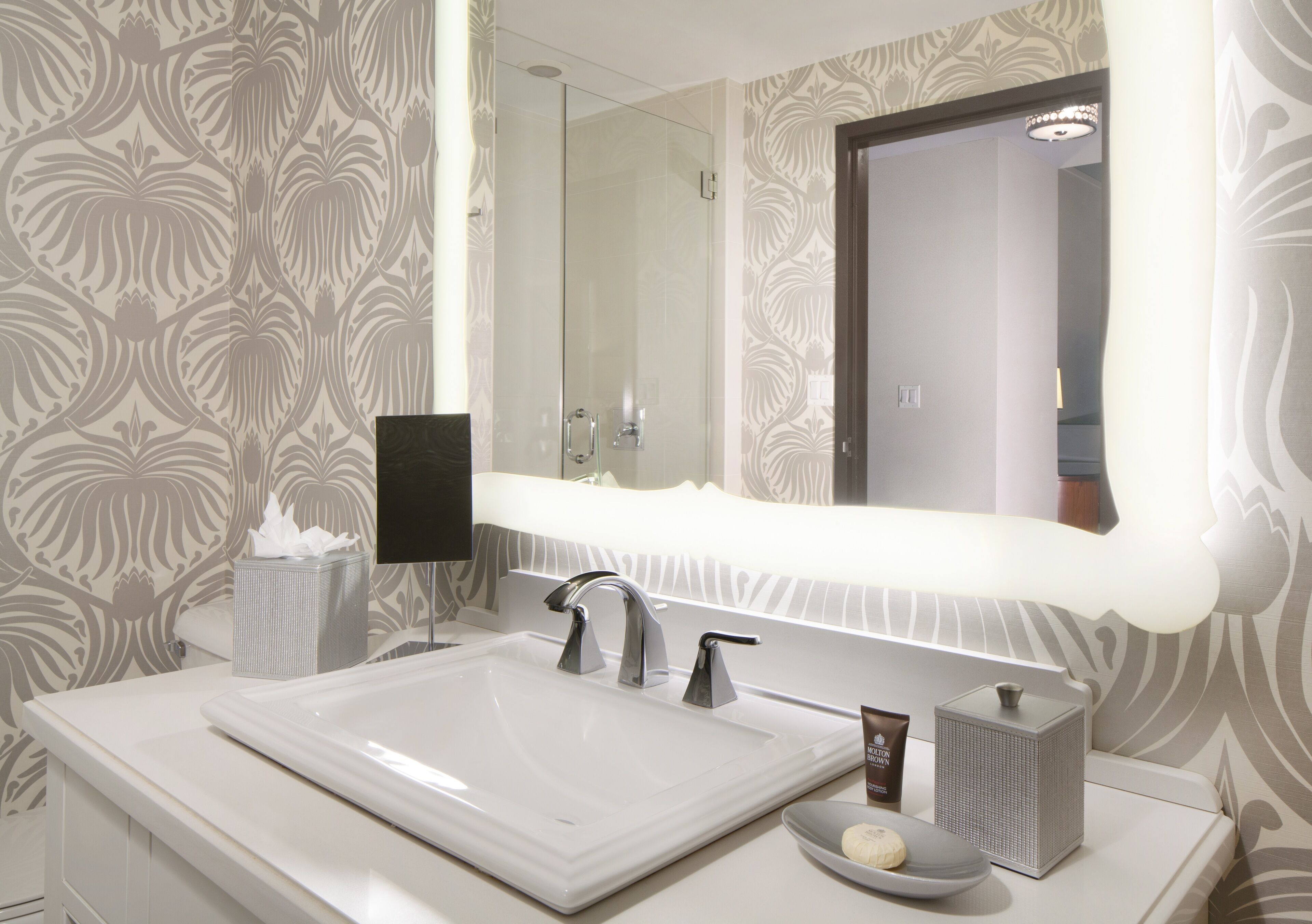 designer toiletries, hair dryer, bathrobes, towels