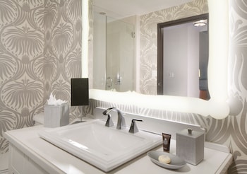 Designer toiletries, hair dryer, bathrobes, towels at Silversmith Hotel Chicago Downtown