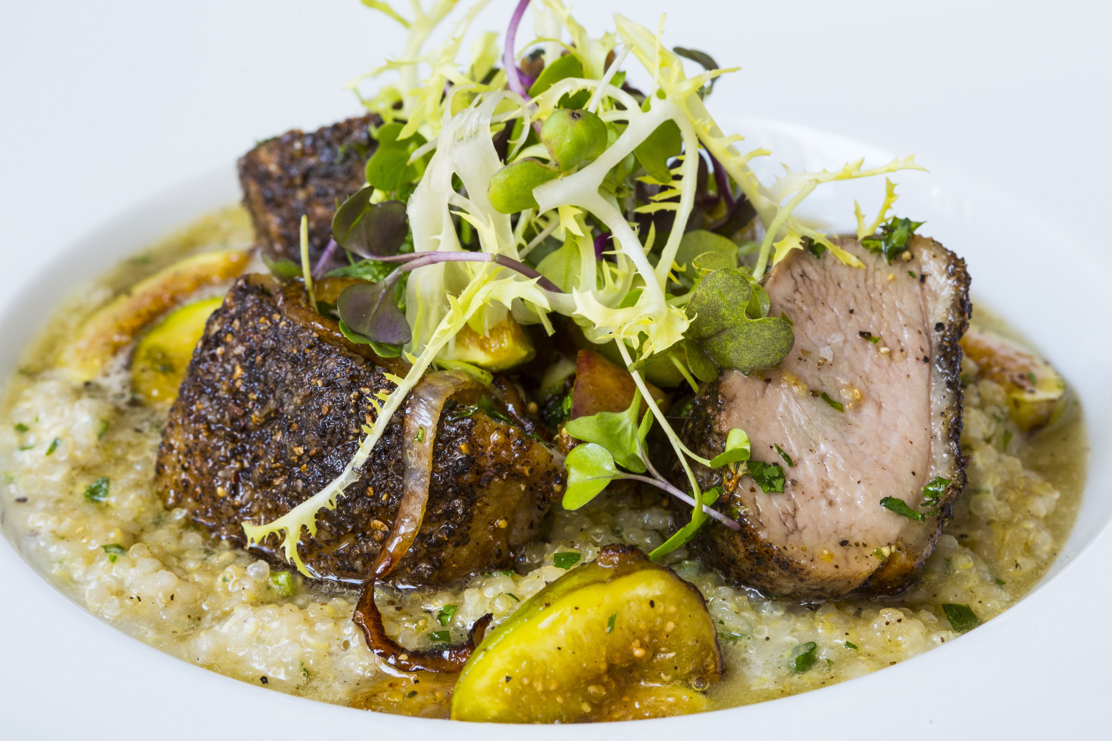 A dish with meat and vegetables on a plate.