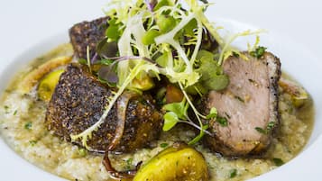 A dish with meat and vegetables on a plate.