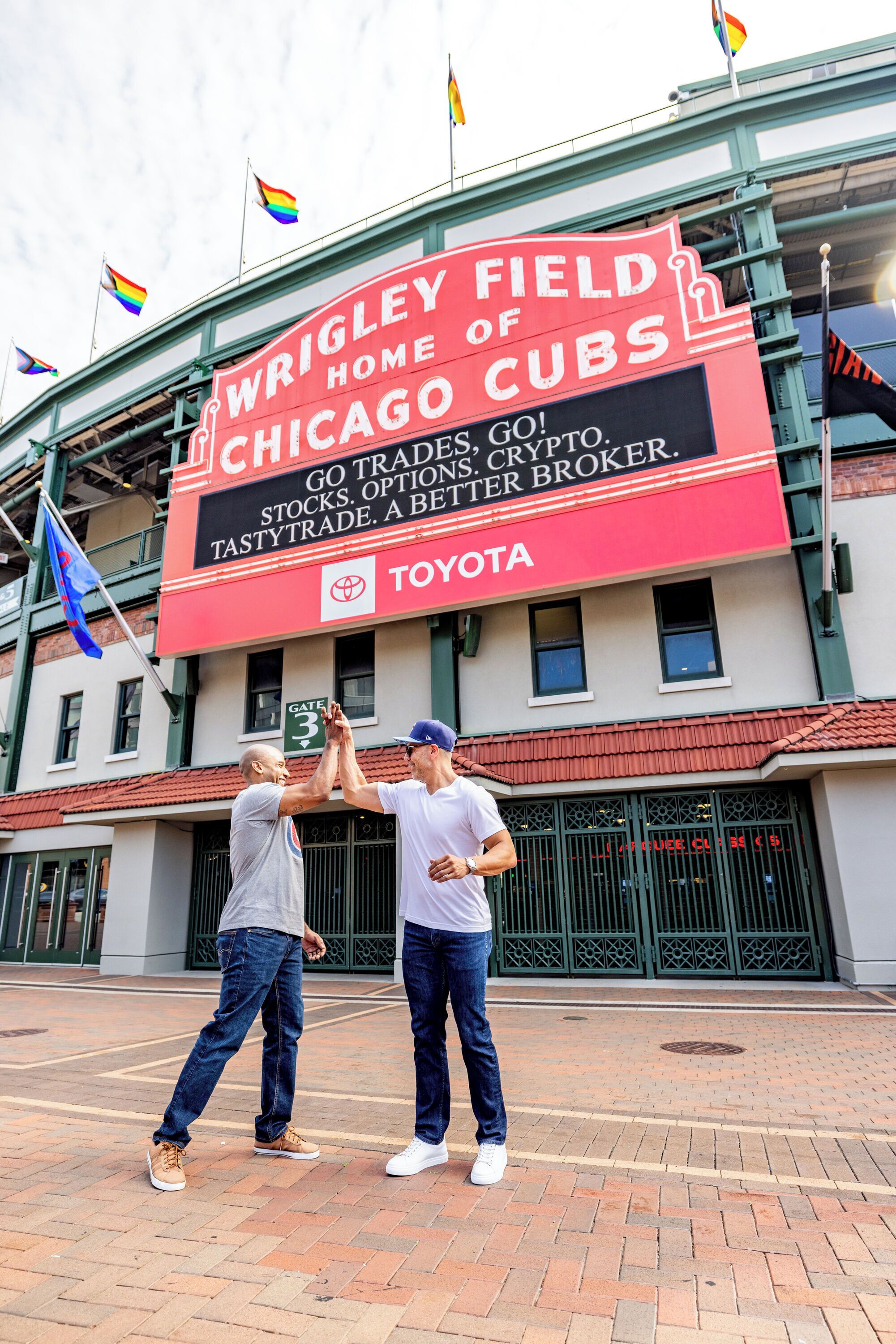 A large sign advertising Wrigley Field, home of the Chicago Cubs, with a Toyota logo.