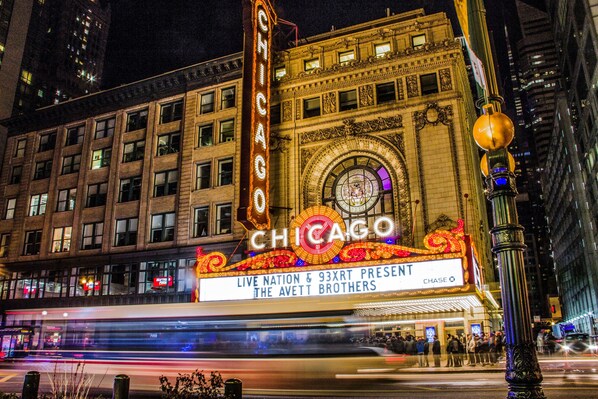 A theater with a marquee reading "CHICAGO" and "LIVE NATION & 93XRT PRESENT THE AVETT BROTHERS".