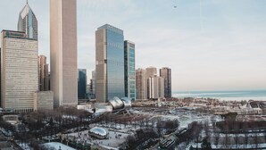 A cityscape with modern skyscrapers, a waterfront, and a winter setting. - Silversmith Hotel Chicago Downtown (Chicago)