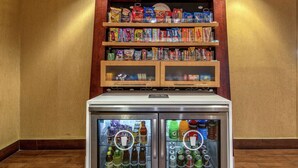 A vending machine with snacks and drinks.