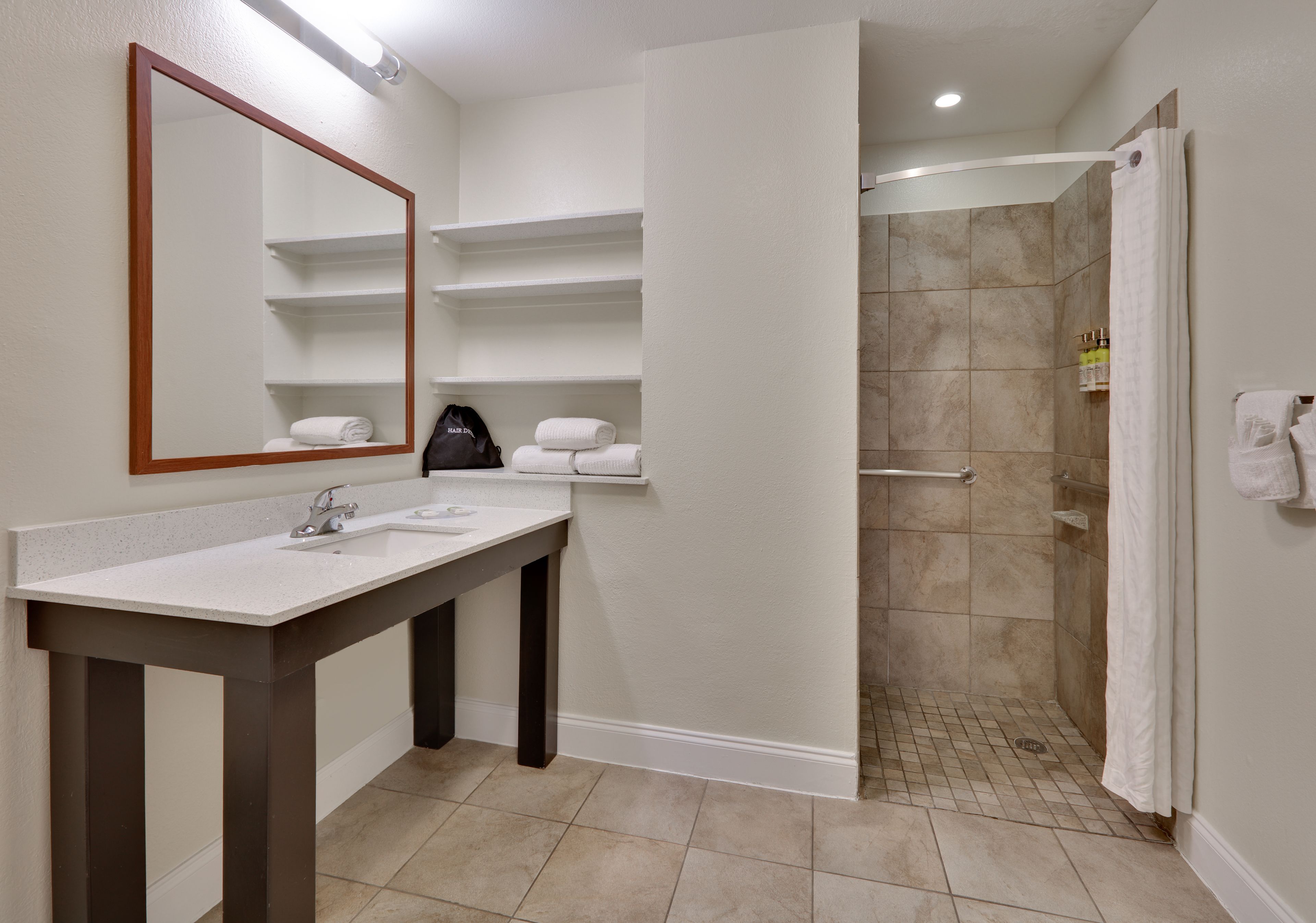 combined shower/bathtub, free toiletries, hair dryer, towels