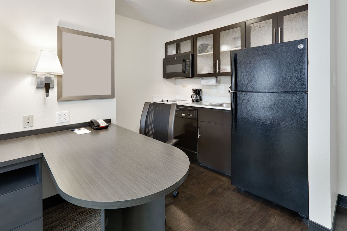 full-sized fridge, microwave, stovetop, dishwasher