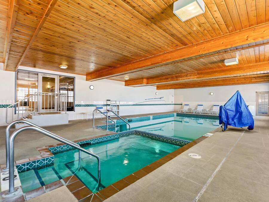 Indoor pool, open 6:00 AM to 10:00 PM, pool loungers