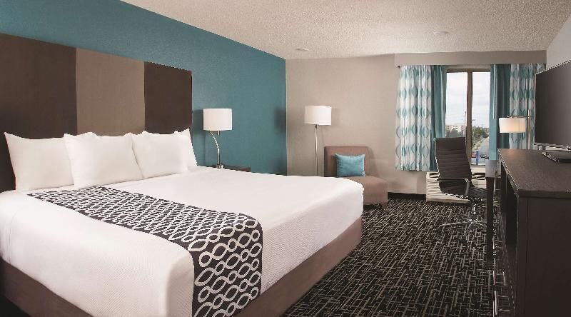 Premium bedding, desk, laptop workspace, iron/ironing board