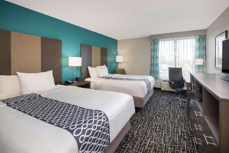 Premium bedding, desk, laptop workspace, iron/ironing board