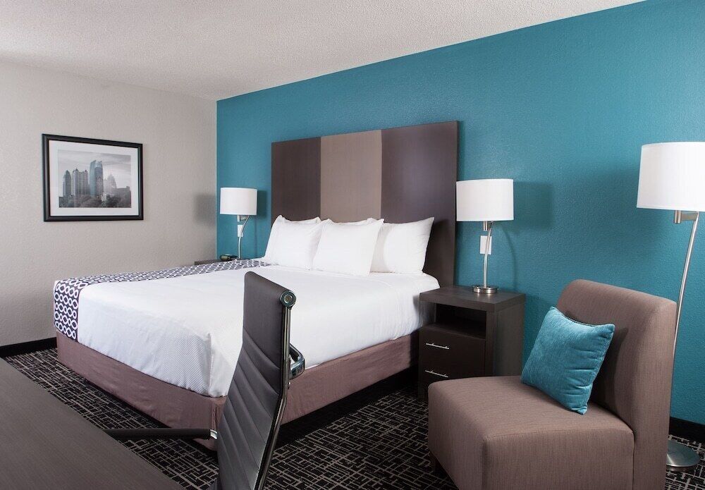 Premium bedding, desk, laptop workspace, iron/ironing board