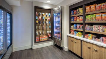 A snack bar with refrigerated and non-refrigerated snack options, including chips and cereals.