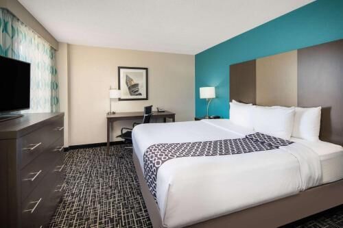 Premium bedding, desk, laptop workspace, iron/ironing board