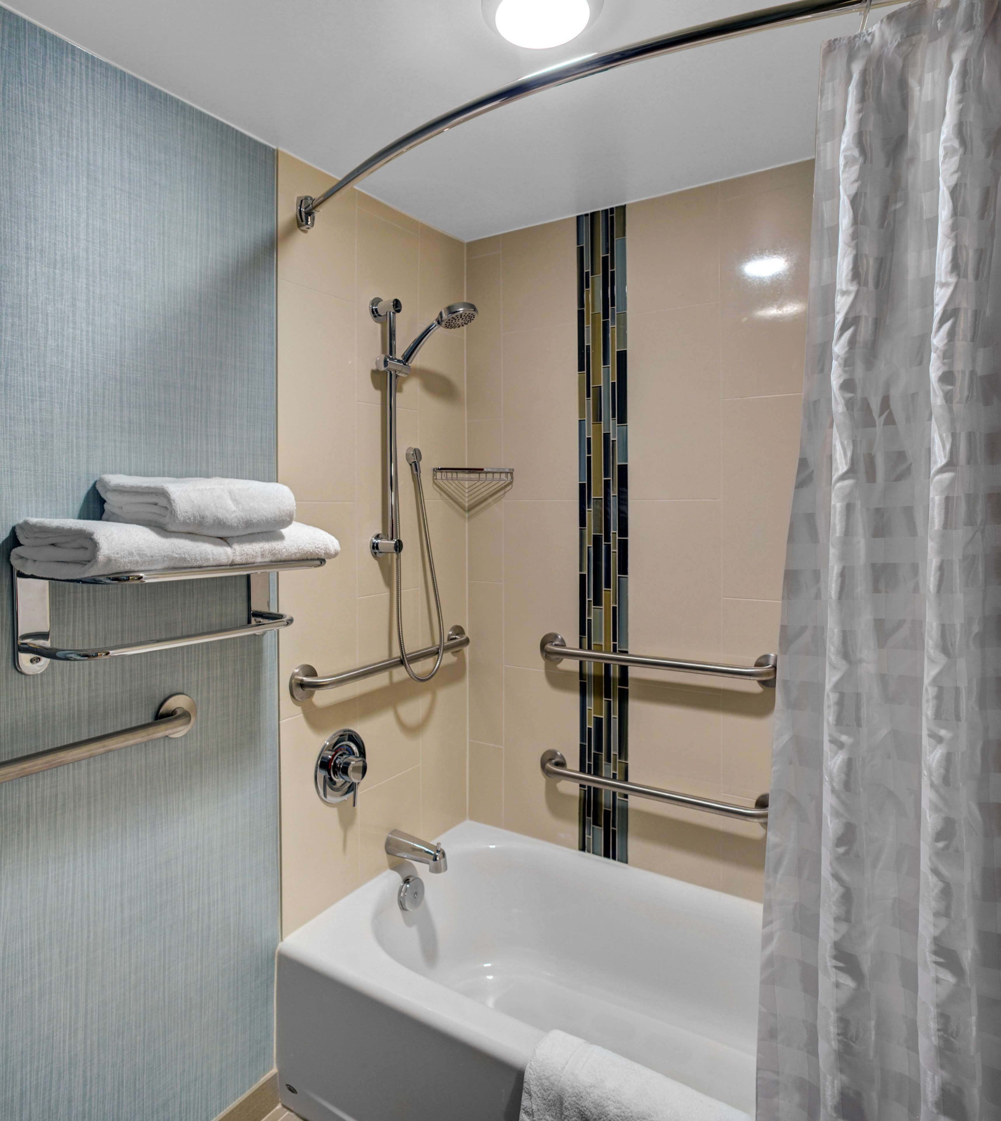 room, 1 king bed | bathroom | combined shower/bathtub, designer toiletries, hair dryer, towels