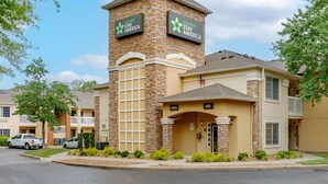 A hotel with a stone facade, two signs reading "extended stay America," and a lobby entrance. - Extended Stay America Suites Nashville Franklin Cool Springs (Franklin)