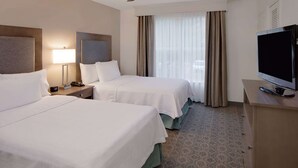 A hotel room with two beds, a television, a desk, and a window with curtains. - Homewood Suites by Hilton Nashville-Brentwood (Brentwood)