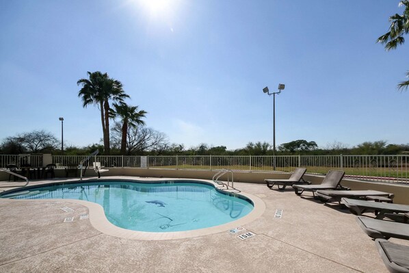 Outdoor pool, open 7:00 AM to 10:00 PM, pool loungers
