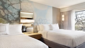 Premium bedding, down duvets, pillow-top beds, in-room safe